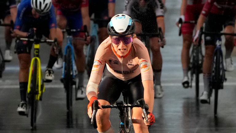 Annemiek van Vleuten races past the finish line to win the elite women's road race 