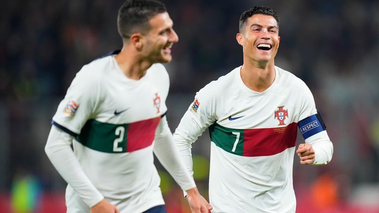 Portugal&#39;s Diogo Dalot, who scored his side&#39;s third goal, celebrates with Cristiano Ronaldo
