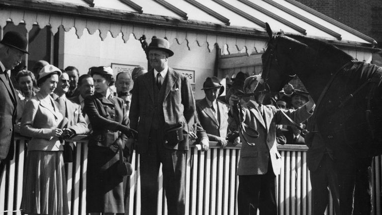 The Queen points to her colt Doutelle, who had just won the 2,000 Guineas Trial Stakes at Kempton Park