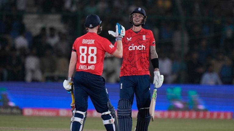 England&#39;s Alex Hales, right, celebrates with batting partner Harry Brook after scoring fifty runs during the first T20 cricket match between Pakistan and England, in Karachi, Pakistan, Tuesday, Sept. 20, 2022. (AP Photo/Anjum Naveed)


