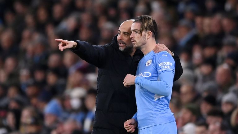 MANCHESTER, ENGLAND - FEBRUARY 9: Pep Guardiola instructs Manchester City's Jack Grealish during the Premier League match between Manchester City and Brentford at the Etihad Stadium on February 09, 2022 in Manchester, England.  (Photo by Lawrence Griffith/Getty Images)