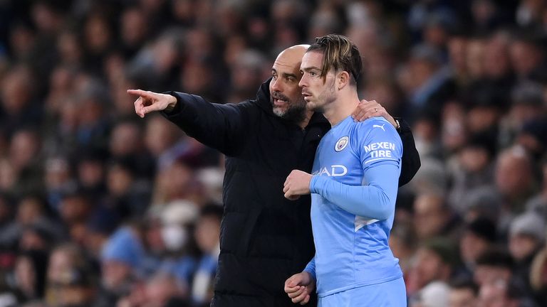 MANCHESTER, ENGLAND - FEBRUARY 09: Pep Guardiola gives instructions to Jack Grealish of Manchester City during the Premier League match between Manchester City and Brentford at Etihad Stadium on February 09, 2022 in Manchester, England. (Photo by Laurence Griffiths/Getty Images)