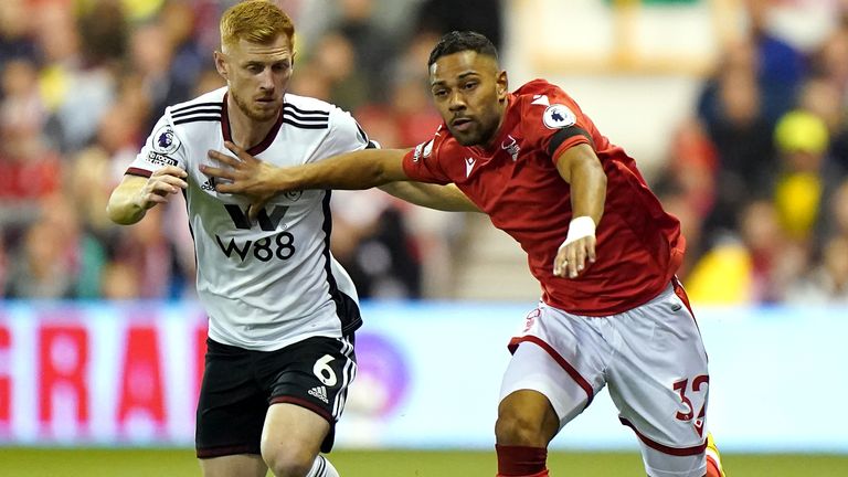 Fulham&#39;s Harrison Reed (left) and Nottingham Forest&#39;s Renan Lodi battle for the ball