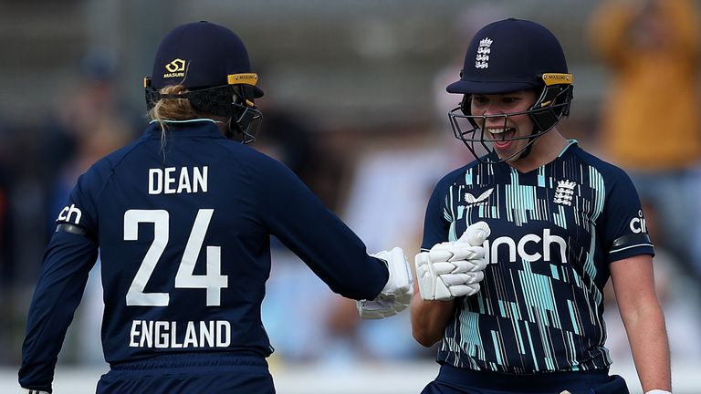 Alice Davidson-Richards celebrates her maiden ODI fifty with fellow England player Charlie Dean
