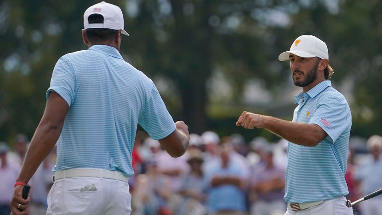 Max Homa, right, celebrates with Tony Finau on the 15th green during their foursomes match at the Presidents Cup golf tournament at the Quail Hollow Club, Thursday, Sept. 22, 2022, in Charlotte, N.C. 