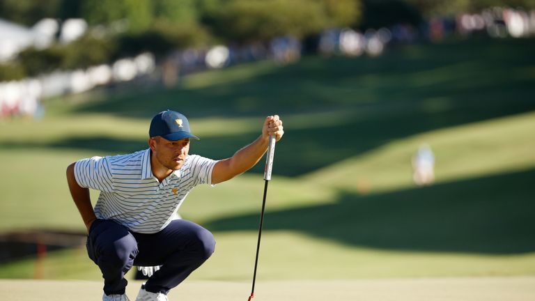 CHARLOTTE, NORTH CAROLINA - SEPTEMBER 23: Xander Schauffele of the United States Team lines up his putt on the 15th green during Friday four-ball matches on day two of the 2022 Presidents Cup at Quail Hollow Country Club on September 23, 2022 in Charlotte, North Carolina. (Photo by Jared C. Tilton/Getty Images)