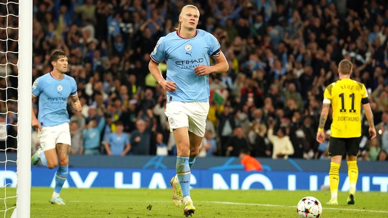 Manchester City's Erling Haaland, center, celebrates after scoring his side's 2nd goal during the group G Champions League soccer match between Manchester City and Borussia Dortmund at the Etihad stadium in Manchester, England, Wednesday, Sept. 14, 2022. (AP Photo/Dave Thompson)