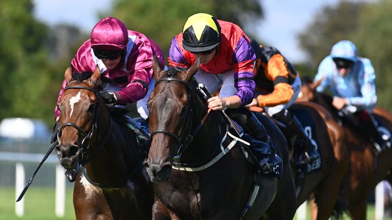 I&#39;m A Gambler and Tom Marquand (yellow star on cap) win the Irish Stallion Farms EBF Sovereign Path Handicap at Leopardstown