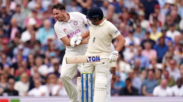 Pitch invader �Jarvo 69� runs across the pitch and collides with England's Jonny Bairstow as he bats during day two of the cinch Fourth Test at the Kia Oval, London. Picture date: Friday September 3, 2021.
