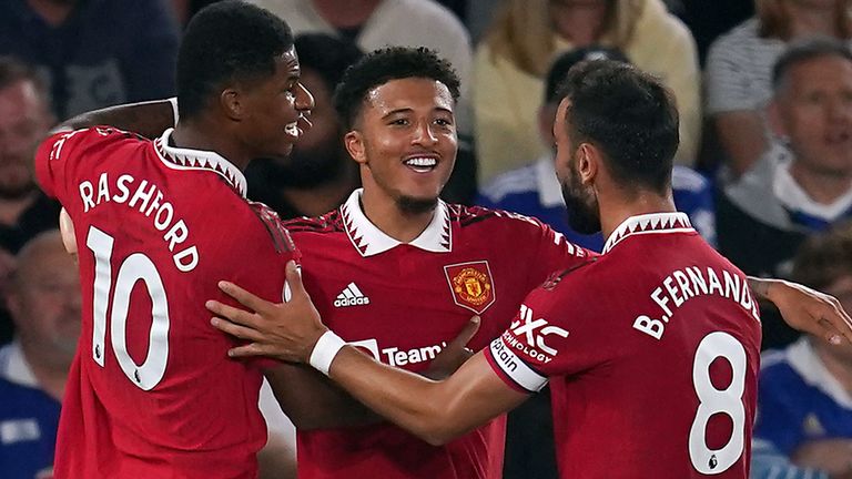 Jadon Sancho is congratulated by Marcus Rashford and Bruno Fernandes after scoring the opening game for Manchester United in Leicester
