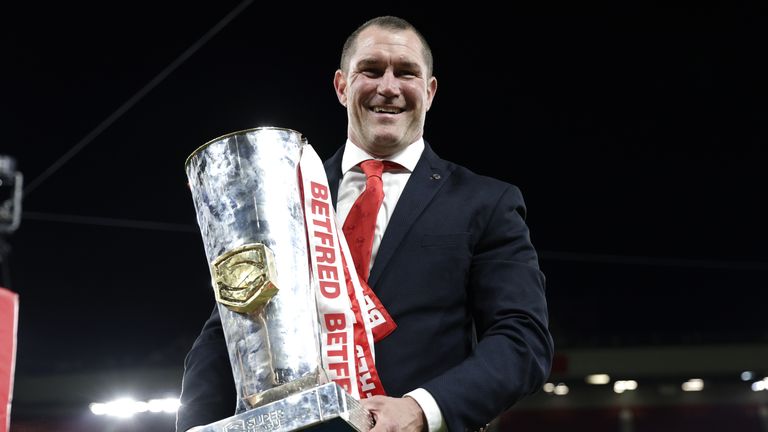 St Helens v Leeds Rhinos - Betfred Super League - Grand Final - Old Trafford
St Helens head coach Kristian Woolf celebrates with the trophy after victory in the Betfred Super League Grand Final at Old Trafford, Manchester. Picture date: Saturday September 24, 2022.