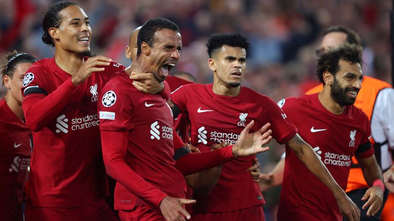 Joel Matip is congratulated by his Liverpool team-mates after scoring a late winner against Ajax