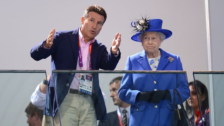 LOCOG Chairman Lord Sebastian Coe (left) speaks to Queen Elizabeth II as they watch the morning session of the Swimming at the Aquatics Centre in London on day one of the London 2012 Olympics.