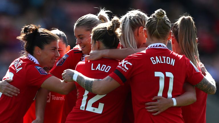 Manchester United players celebrate Maya Le Tissier's goal