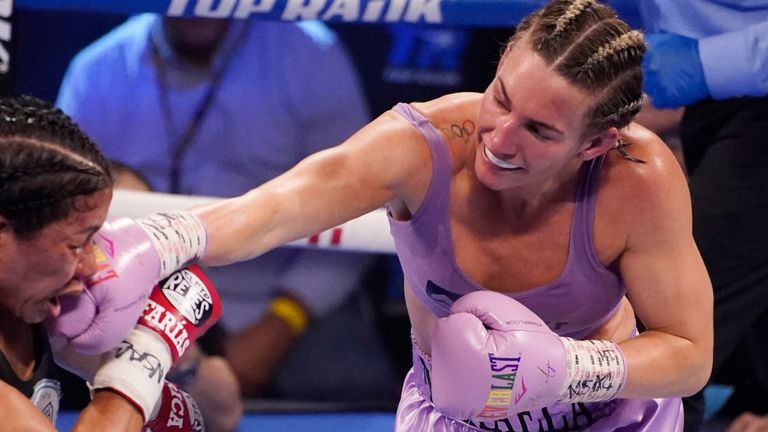 Mikaela Mayer hits Erica Farias, of Argentina, in a WBO female junior lightweight title fight Saturday, June 19, 2021, in Las Vegas. (AP Photo/John Locher)