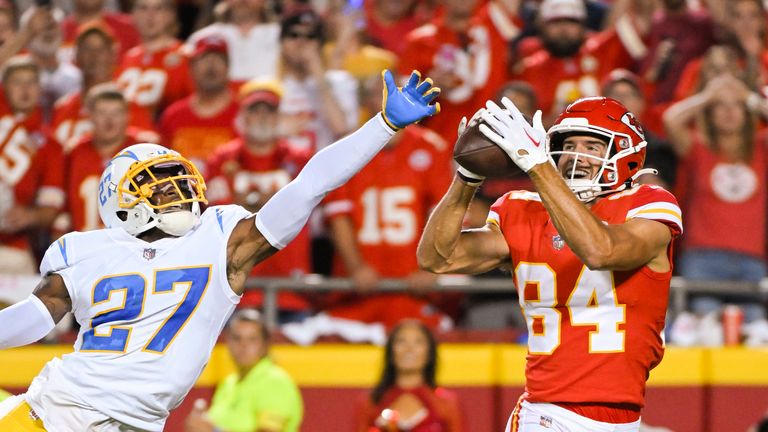 Kansas City Chiefs wide receiver Justin Watson (84) pulls in a touchdown pass over the outstretched hand of Los Angeles Chargers cornerback J.C. Jackson (27) during an NFL football game, Thursday, Sept. 15, 2022 in Kansas City, Mo. (AP Photo/Reed Hoffmann)


