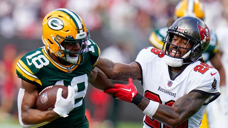 Green Bay Packers&#39; Randall Cobb runs after a catch past Tampa Bay Buccaneers&#39; Logan Ryan during the first half of an NFL football game Sunday, Sept. 25, 2022, in Tampa, Fla.