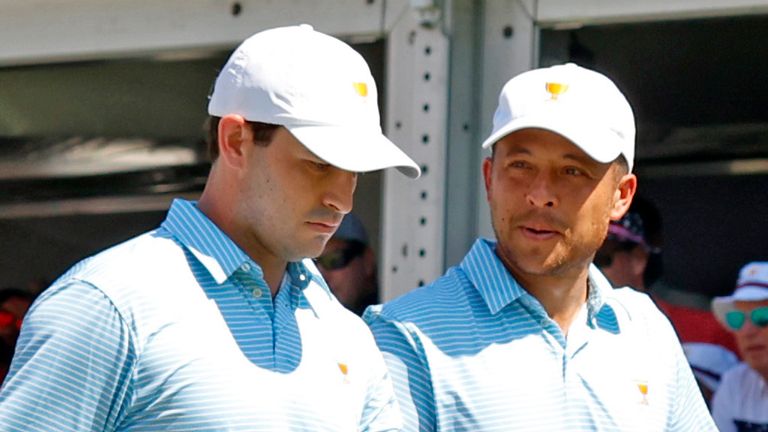 CHARLOTTE, NC - SEPTEMBER 22: Former USA Presidents Cup players Patrick Cantlay on left and Xander Schauffele walk the first hole during the first round on September 22, 2022 at Quail Hollow Club in Charlotte, North Carolina. (Photo by Brian Spurlock/Icon Sportswire) (Icon Sportswire via AP Images)