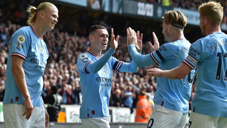 Manchester City's Phil Foden celebrates with team-mates after scoring his side's third goal (AP)