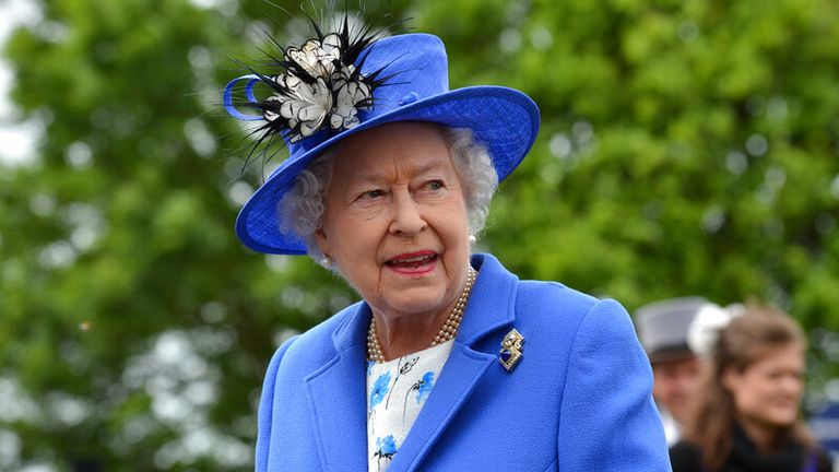 Queen Elizabeth II views the horses in the parade ring on Derby Day at Epsom