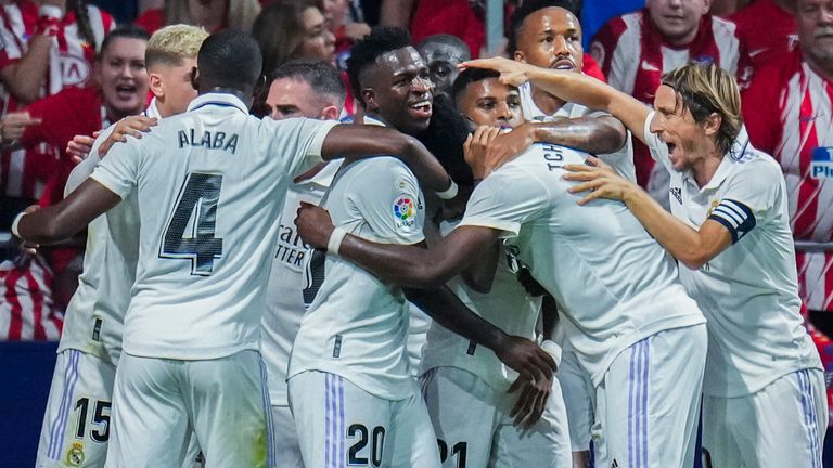 Real Madrid players celebrate after teammate Rodrygo scores the opening goal in the Madrid derby