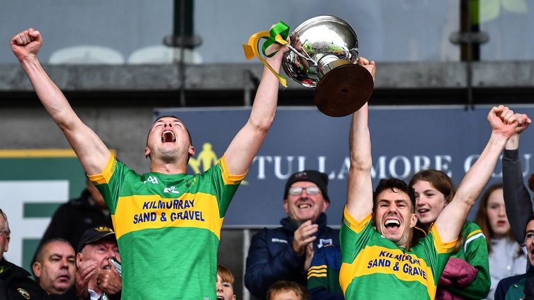 25 September 2022; Rhode captains Darren Garry, left, and Niall McNamee lift the trophy after their victory in the Offaly County Senior Football Championship Final match between Tullamore and Rhode at O'Connor Park in Tullamore, Offaly. Photo by Ben McShane/Sportsfile