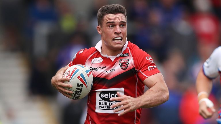  Brodie Croft of Salford Red Devils runs with the ball during the Betfred Super League between Salford Red Devils and Wakefield Trinity at AJ Bell Stadium on June 26, 2022 in Salford, England.