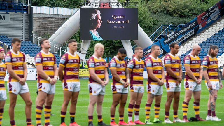 Picture by Allan McKenzie/SWpix.com - 10/09/2022 - Rugby League - Betfred Super League Eliminator - Huddersfield Giants v Salford Red Devils - John Smith's Stadium, Huddersfield, England - Hudersfield & Salford stand for a minute's silence in rememberance of Queen Elizabeth the Second.