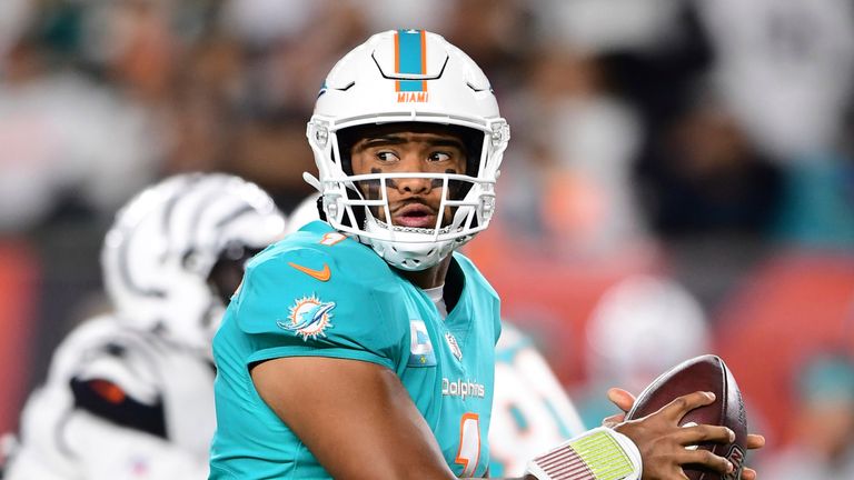 Miami Dolphins quarterback Tua Tagovailoa (1) drops back to pass during the first half of an NFL football game against the Cincinnati Bengals, Thursday, Sept. 29, 2022, in Cincinnati. (AP Photo/Emilee Chinn)