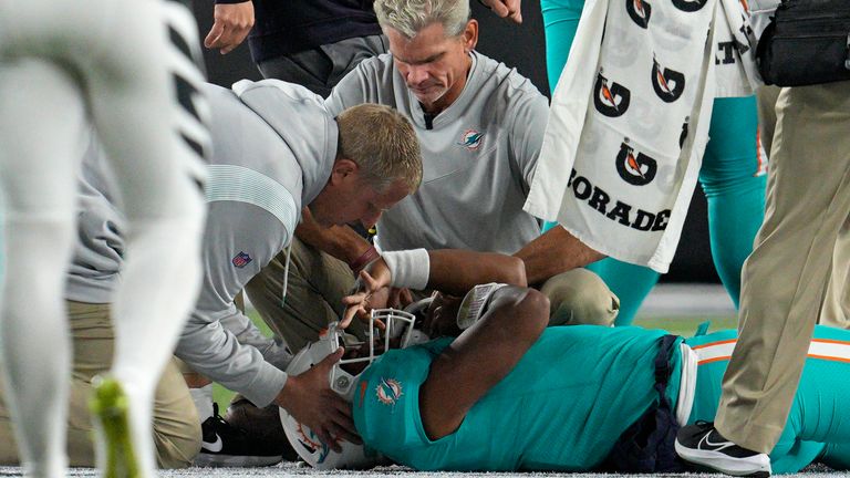 Tua Tagovailoa is examined by Miami Dolphins medical staff 
