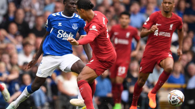 Virgil van Dijk has been booked for this challenge on Everton's Amadou Onana