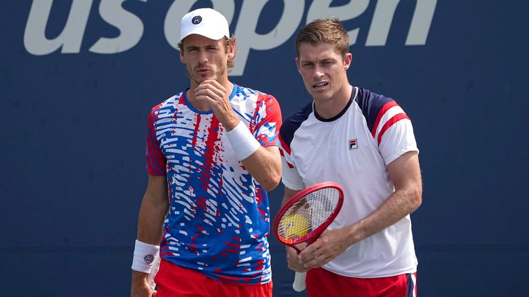 Wesley Koolhof and Neal Skupski look on during a men&#39;s doubles match at the 2022 US Open, Monday, Sep. 5, 2022 in Flushing, NY. (Garrett Ellwood/USTA via AP)