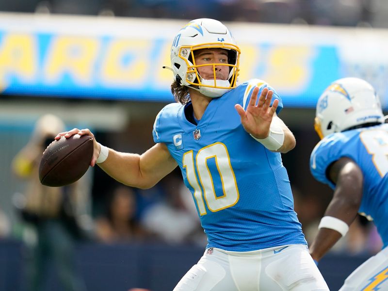 Justin Herbert, Austin Ekeler hit milestones as Chargers rout Rams