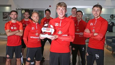 Jack Clarke and his Sunderland team-mates with the September Sky Bet Championship Goal of the Month trophy
