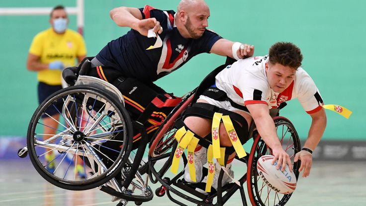 Picture by Will Palmer/SWpix.com - 13/11/2021 - Rugby League - Wheelchair International - England v France - Medway Park Sports Centre, Gillingham, England - Tom Halliwell (C) of England is tackled by Jérémy Bourson of France