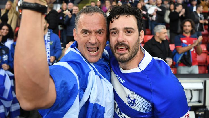 England v Greece: Rugby League World Cup
SHEFFIELD, ENGLAND - OCTOBER 29: Adam Vrahnos of Greece interacts with a member of the crowd following the Rugby League World Cup 2021 Pool A match between England and Greece at Bramall Lane on October 29, 2022 in Sheffield, England. (Photo by Gareth Copley/Getty Images)