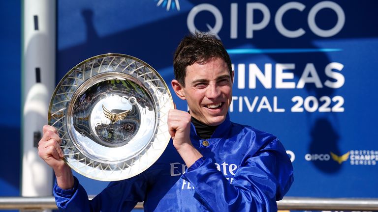 James Doyle lifts the 2000 Guineas trophy at Newmarket