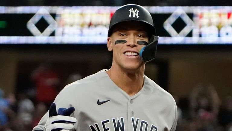New York Yankees' Aaron Judge celebrates his 62nd home run of the season