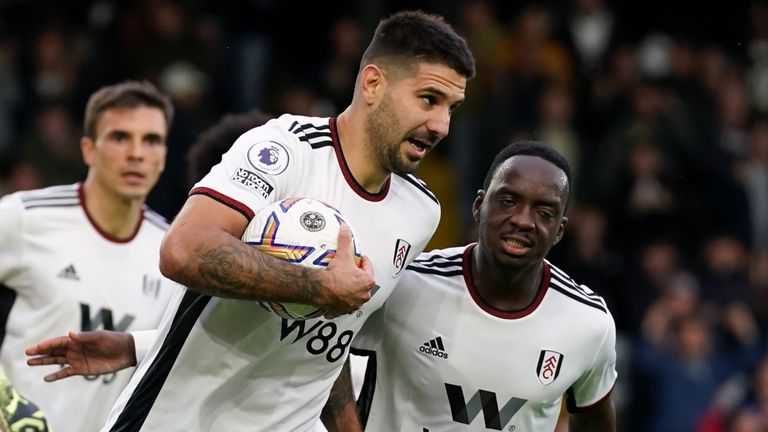 Aleksandar Mitrovic grabs the ball after levelling from the penalty spot for Fulham against Bournemouth