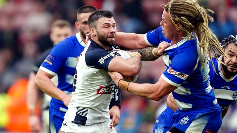 England v Greece - Rugby League World Cup - Group A - Bramall Lane
England's Andy Ackers tackled by Greece's Mitchell Zampetides during the Rugby League World Cup group A match at Bramall Lane, Sheffield. Picture date: Saturday October 29, 2022.