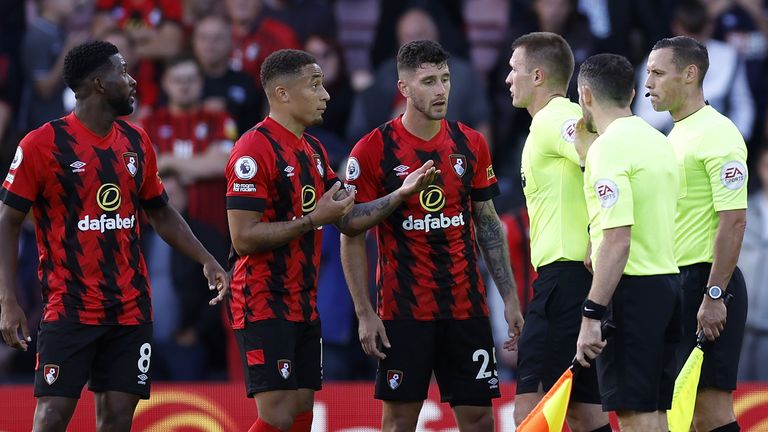 Bournemouth players protest the penalty calls