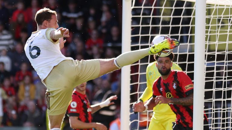 Jonny Evans attempts to hook the ball into the Bournemouth net