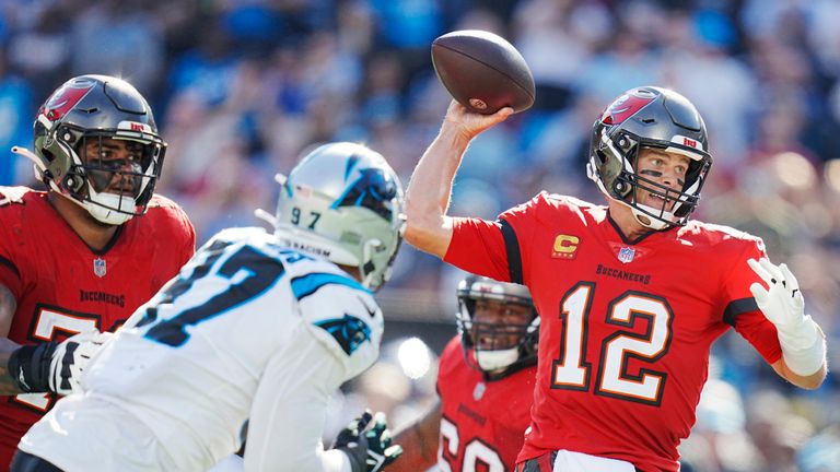 Tampa Bay Buccaneers quarterback Tom Brady (12) looks to pass as Carolina Panthers defensive end Yetur Gross-Matos (97) closes in during the second half of an NFL football game against the Carolina Panthers Sunday, Oct. 23, 2022, in Charlotte, N.C.