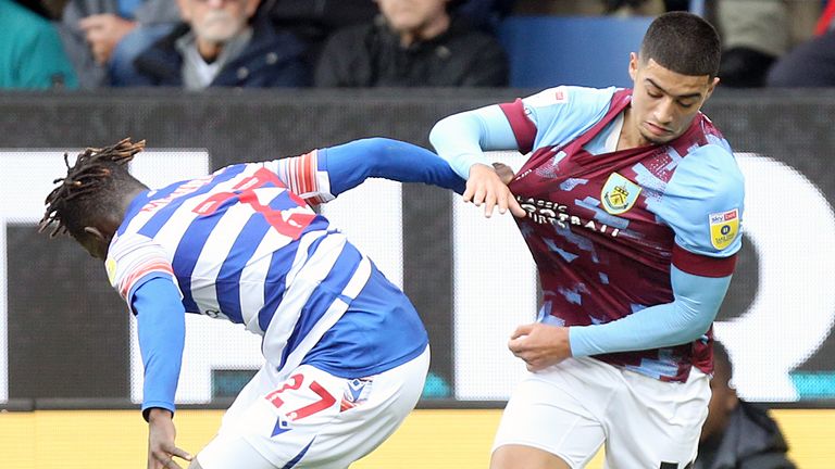 BURNLEY, ENGLAND - OCTOBER 29:Burnley's  Anass Zarqury battles for possession with Reading's Amadou Mbengue  during the Sky Bet Championship between Burnley and Reading at Turf Moor on October 29, 2022 in Burnley, United Kingdom. (Photo by Rich Linley - CameraSport via Getty Images)                                                                                                                            