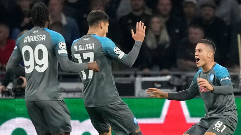 Napoli's Giacomo Raspadori celebrates with team-mates Mathias Olivera and Andre-Frank Zambo Anguissa after scoring against Ajax