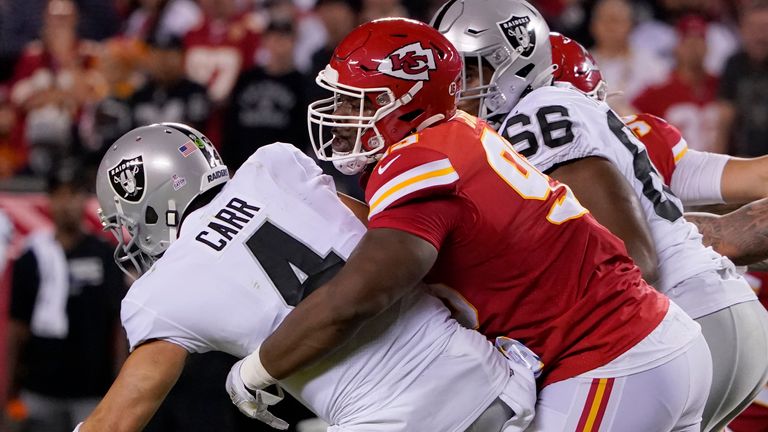 Las Vegas Raiders quarterback Derek Carr (4) is sacked by Kansas City Chiefs defensive tackle Chris Jones, right, during the first half of an NFL football game Monday, Oct. 10, 2022, in Kansas City, Mo. (AP Photo/Ed Zurga)