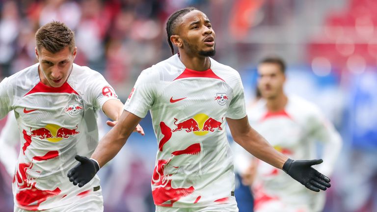 Leipzig&#39;s Christopher Nkunku, right, and Willi Orban celebrate after scoring during the German Bundesliga soccer match between RB Leipzig and VfL Bochum in Leipzig, Germany, Saturday, Oct. 1, 2022.