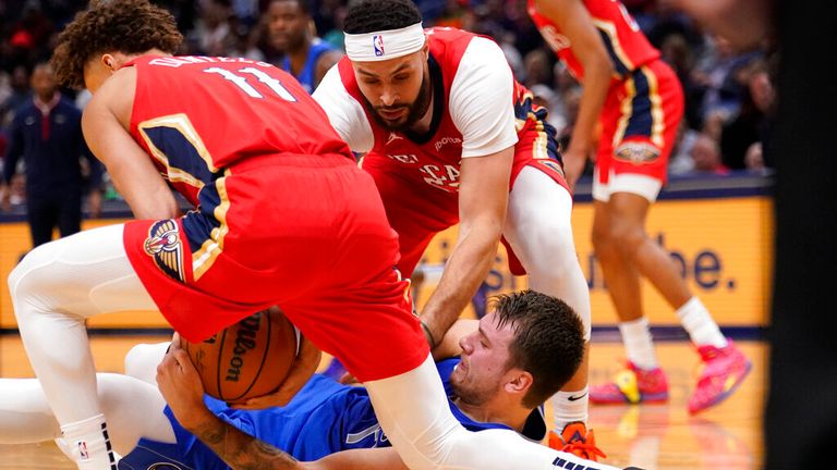 New Orleans Pelicans guard Dyson Daniels (11) strips the ball from Dallas Mavericks guard Luka Doncic in the first half of an NBA basketball game in New Orleans, Tuesday, Oct. 25, 2022. (AP Photo/Gerald Herbert)