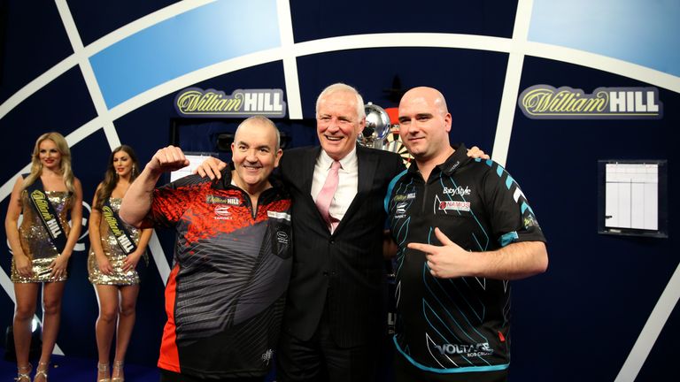Phil Taylor, Barry Hearn, chairman of PDC, and Rob Cross celebrate with the trophy after the final during day fifteen of the William Hill World Darts Championship at Alexandra Palace, London.
