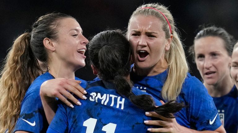 United States' Sophia Smith celebrates with teammates after scoring her side's opening goal during the women's friendly soccer match between England and the US at Wembley stadium in London, Friday, Oct. 7, 2022. (AP Photo/Kirsty Wigglesworth)